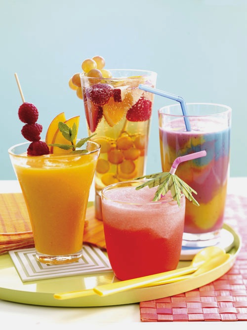 Icy Tropical DrinksAdd The Fruits Like Pineapples Kiwis Bananas And Citrus In A Table Presentable Hued Bowl Full With Drinks